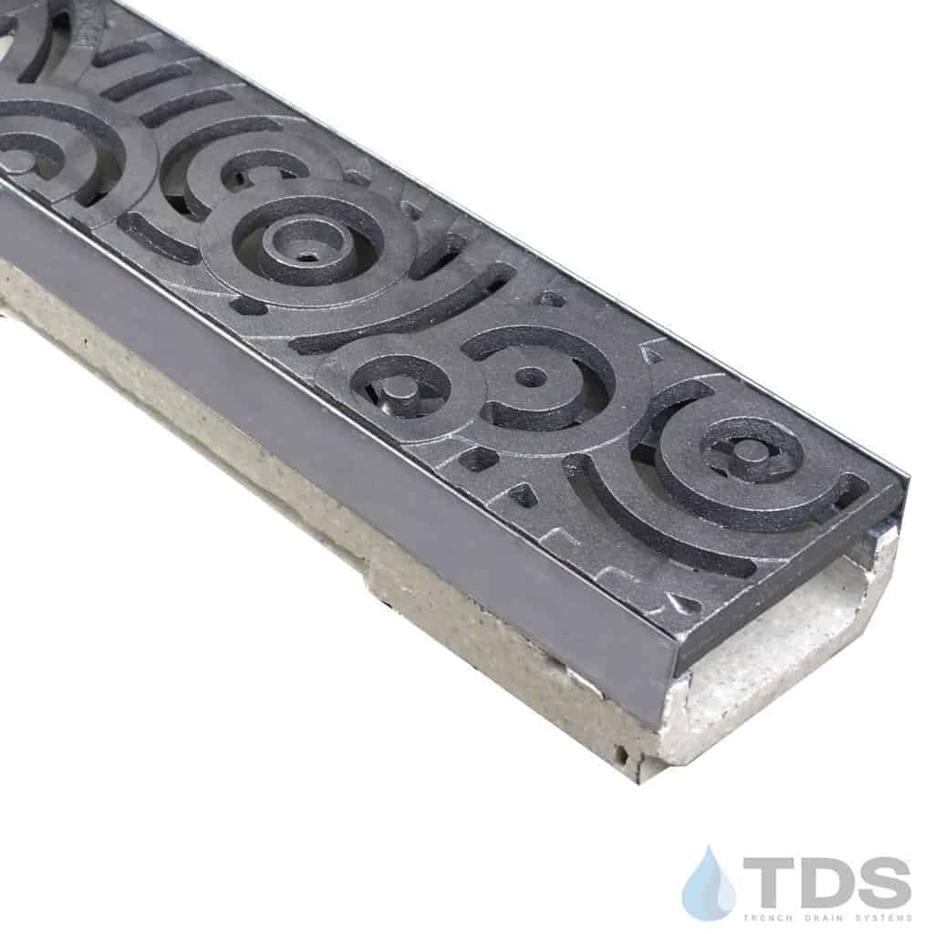 ULMA M100KX polymer concrete channel with stainless steel edge and Iron Age Raw Cast Iron Oblio grate